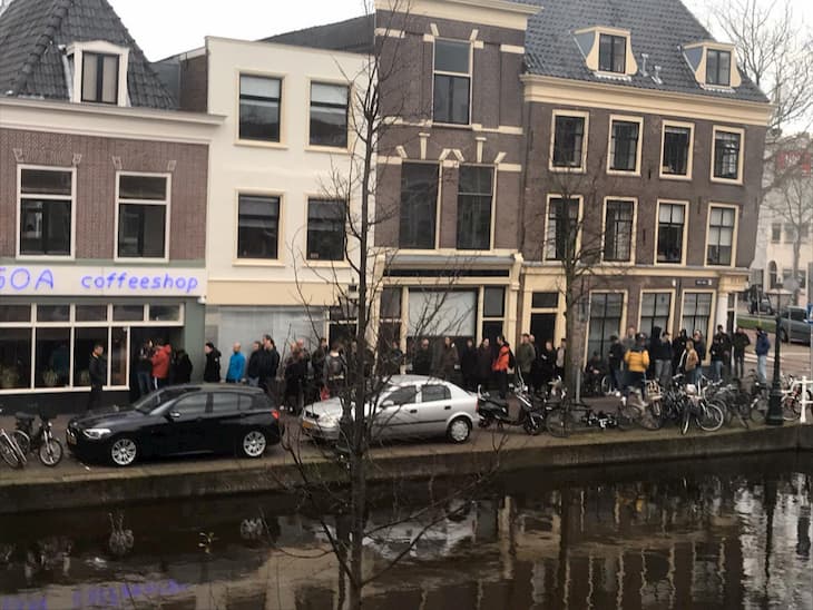 dutch people waiting near coffee shop for weed